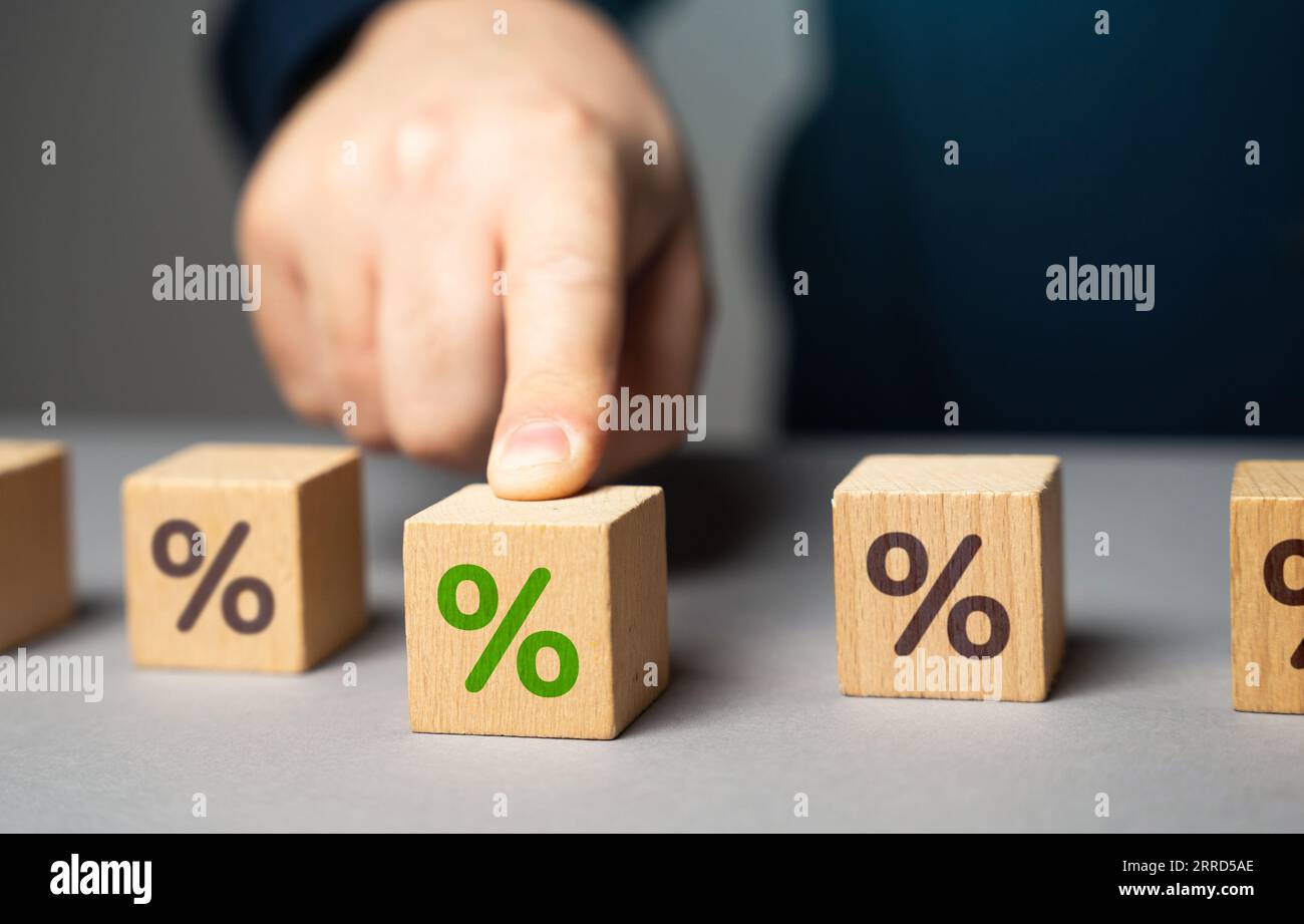 Scegliere una percentuale. Scegliere il piano di prestito più adatto. Determinare l'importo che può essere concesso per prendere in prestito e rimborsare. I prestatori di denaro possono offrire interessi variabili Foto Stock