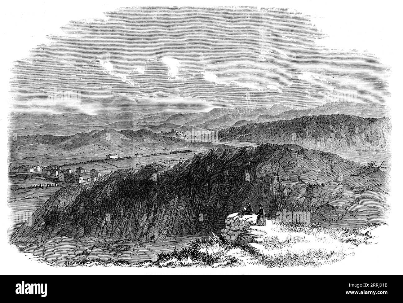 La ferrovia di Llandudno fu inaugurata il 1 ottobre 1858. Il St. George's Harbour Railway, tra Llandudno e il Conway...commences su una curva, ai piedi del ponte sospeso, giungendo con la ferrovia Chester and Holyhead... attraversa poi la strada turnpike, e si estende lungo la costa di Conway, tenendo in vista la catena montuosa di Penmaenmawr, lo stretto e la città di Beaumaris... questa ferrovia è di grande importanza per Llandudno, in quanto porta questo delizioso luogo di irrigazione in connessione con tutte le principali linee ferroviarie. Llandudno sta rapidamente diventando importante, e Bid Foto Stock