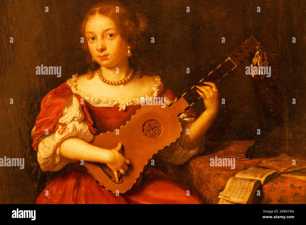 Inghilterra, Londra, Heartford House, The Wallace Collection Museum, dipinto intitolato "Una signora che gioca la chitarra" di Caspar Netscher datato 1669 Foto Stock