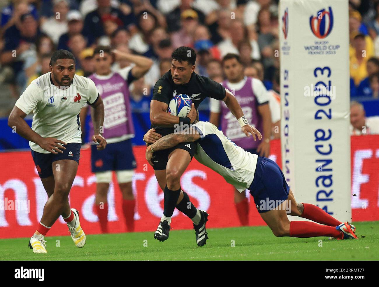 New Zealand's Richie Mo'unga, left, is tackled by France's Matthieu  Jalibert during the Rugby World Cup Pool A match between France and New  Zealand in Saint-Denis, north of Paris, Friday, Sept, 8,