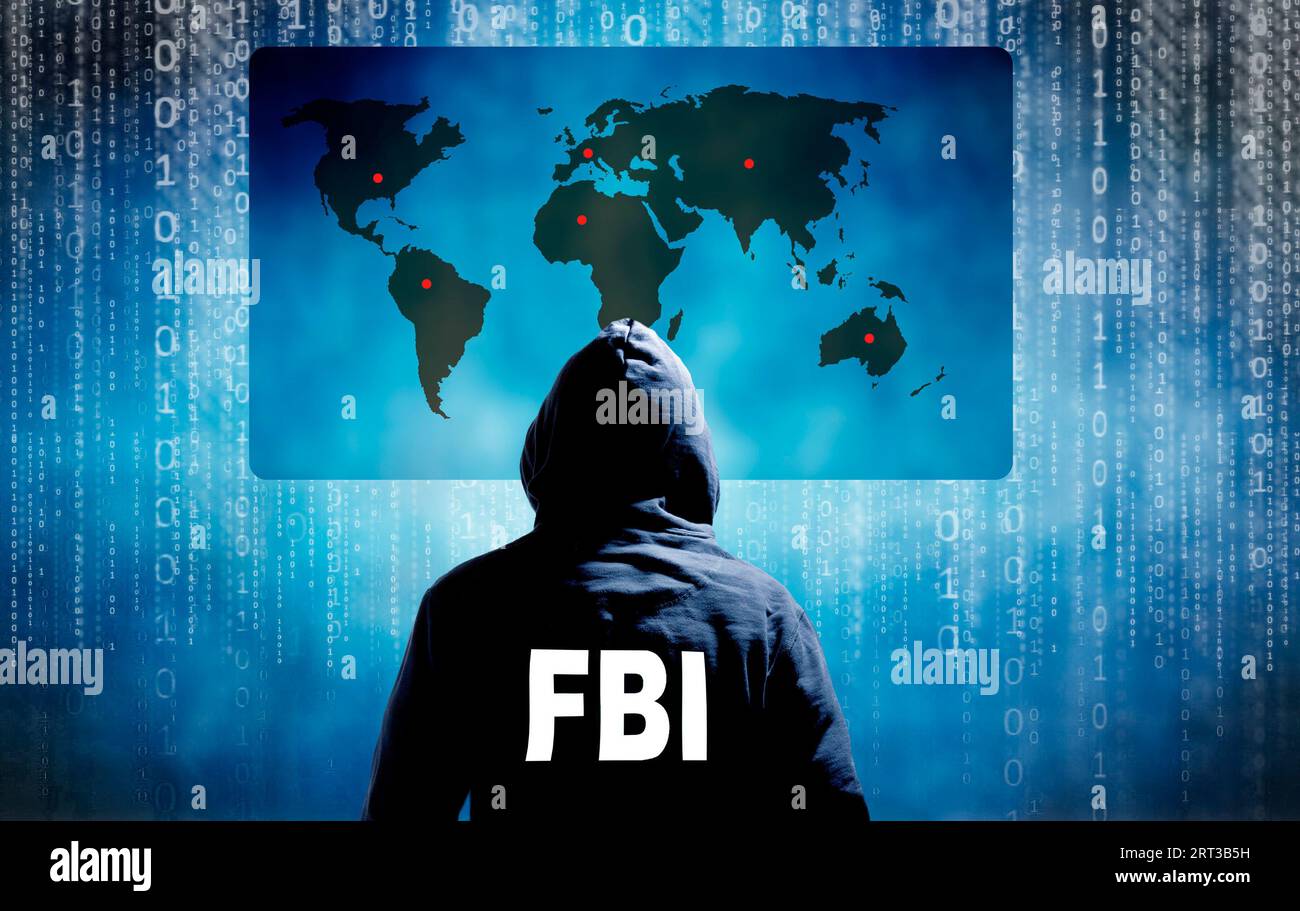 Agente dell'FBI anti-cybercrimine e mappa del mondo Foto Stock