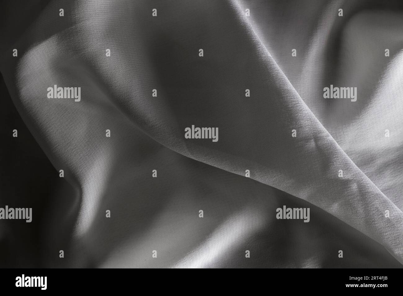 Tessuto bianco a trama ondulata con ombre, più scure, primi piani Foto Stock