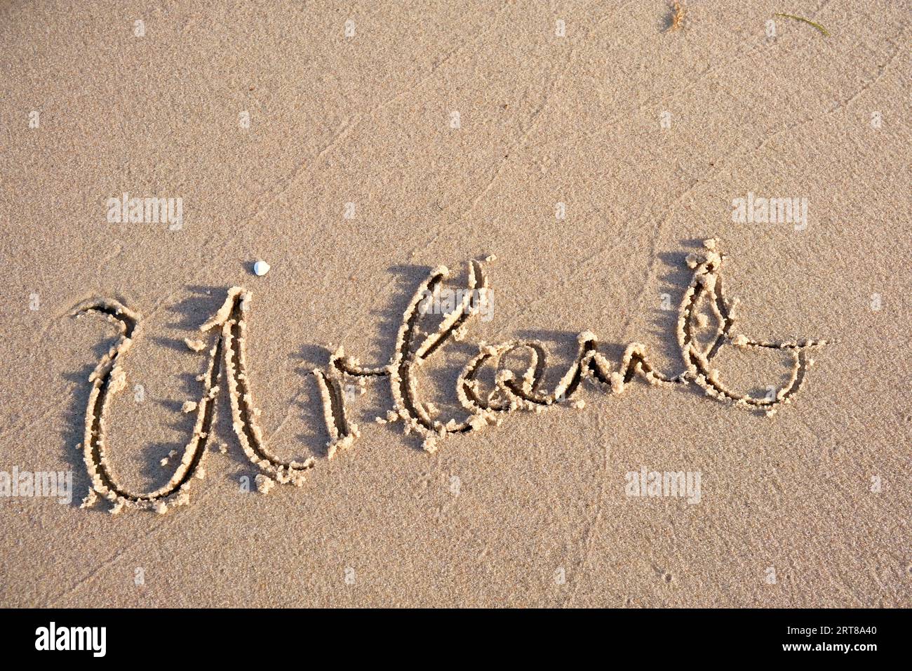 Parola di vacanza nella sabbia della spiaggia Foto Stock