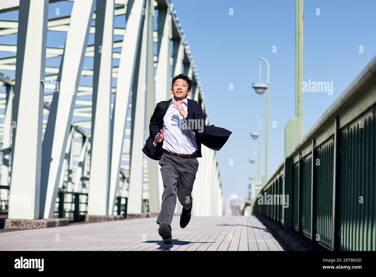 Un giapponese che corre Foto Stock
