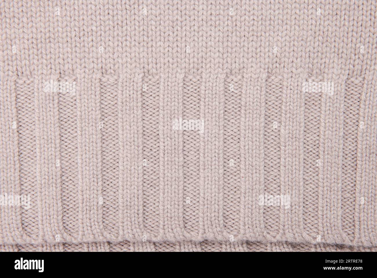 Primo piano con texture di sfondo caldo del pullover. Autunno, vestiti invernali. industria leggera Foto Stock