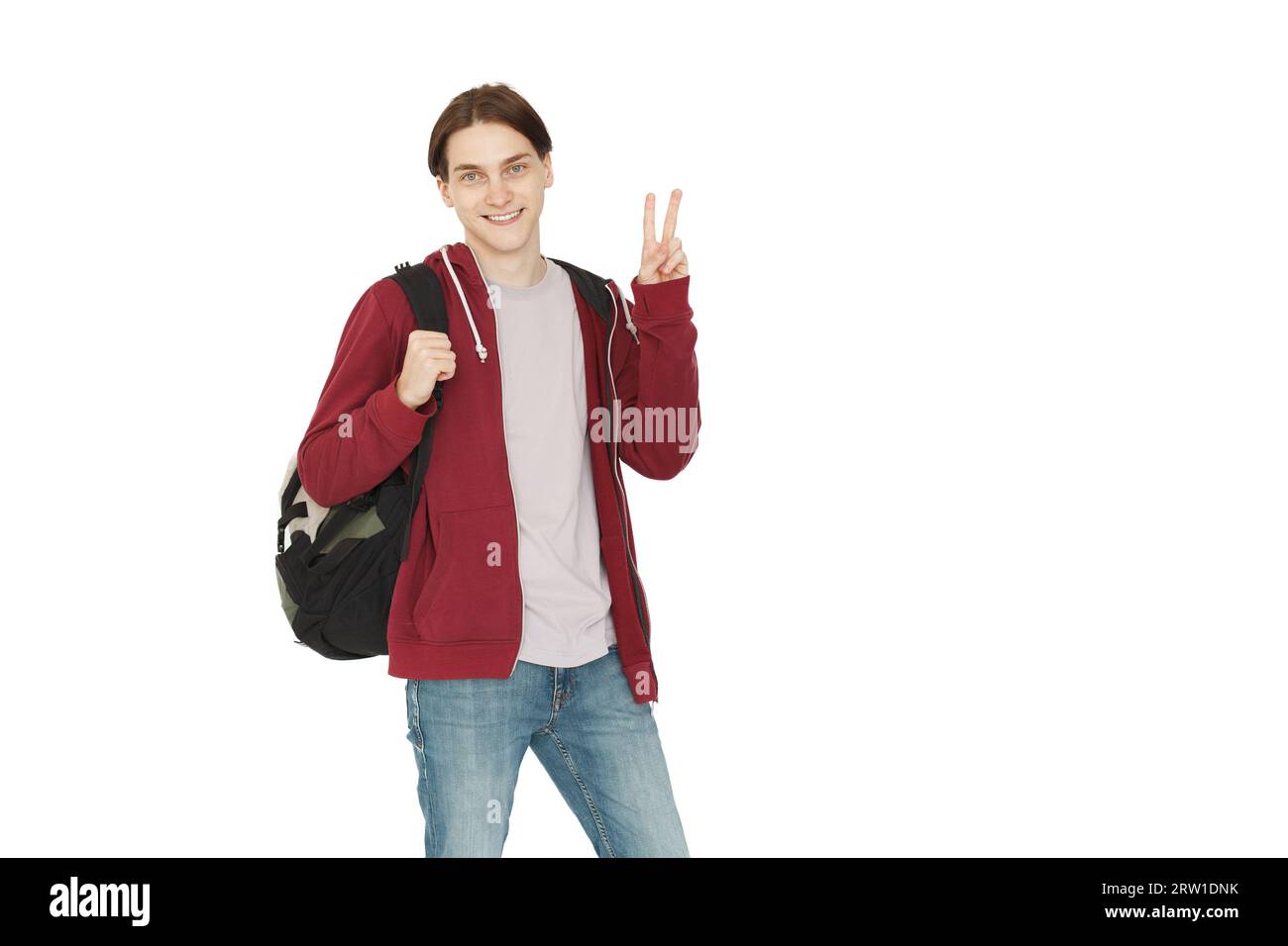 Felice giovane studente con felpa con cappuccio e zip casual in piedi isolata su sfondo bianco Foto Stock