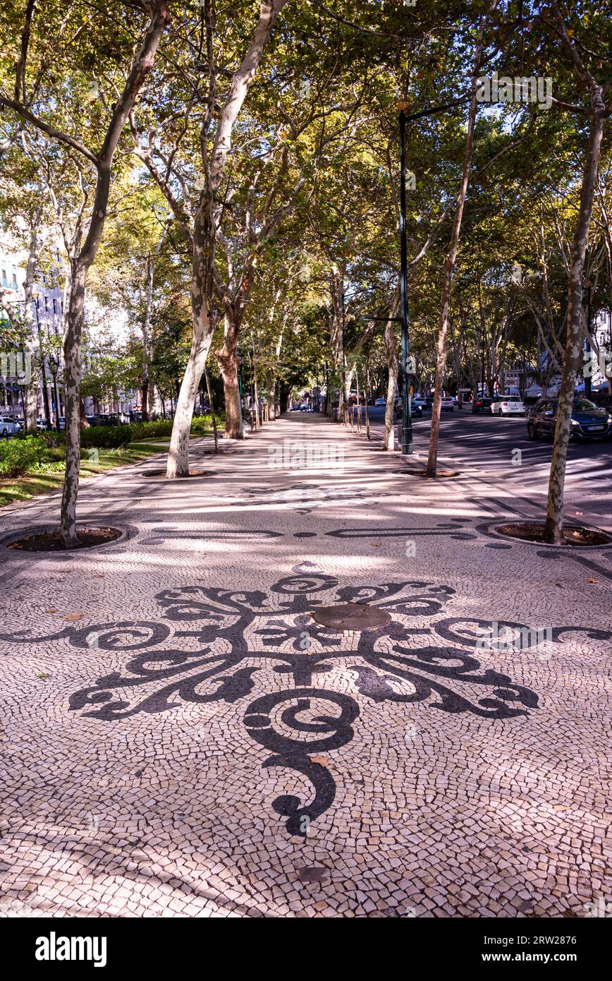 Pavimentazioni piastrellate portoghesi (calcada portuguesa), strade a mosaico a Lsbon Foto Stock