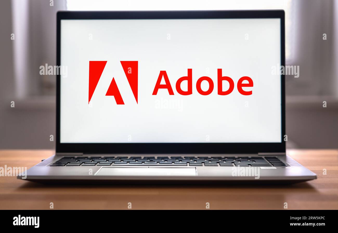 Società di software per computer Adobe - logotipo visualizzato sul laptop Foto Stock