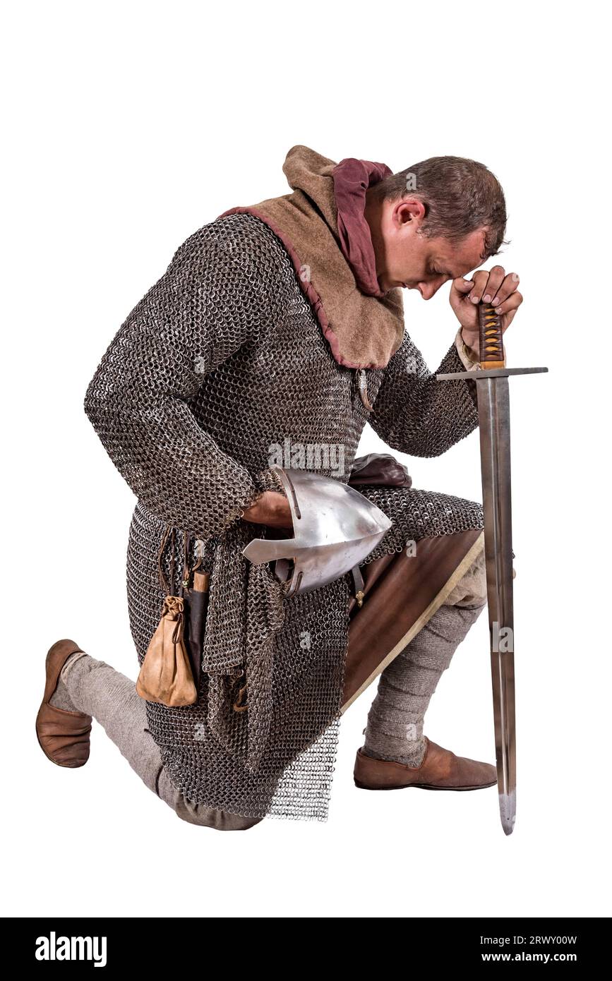 Norman Knight II metà dell'XI secolo in preghiera. Isolato su bianco Foto Stock