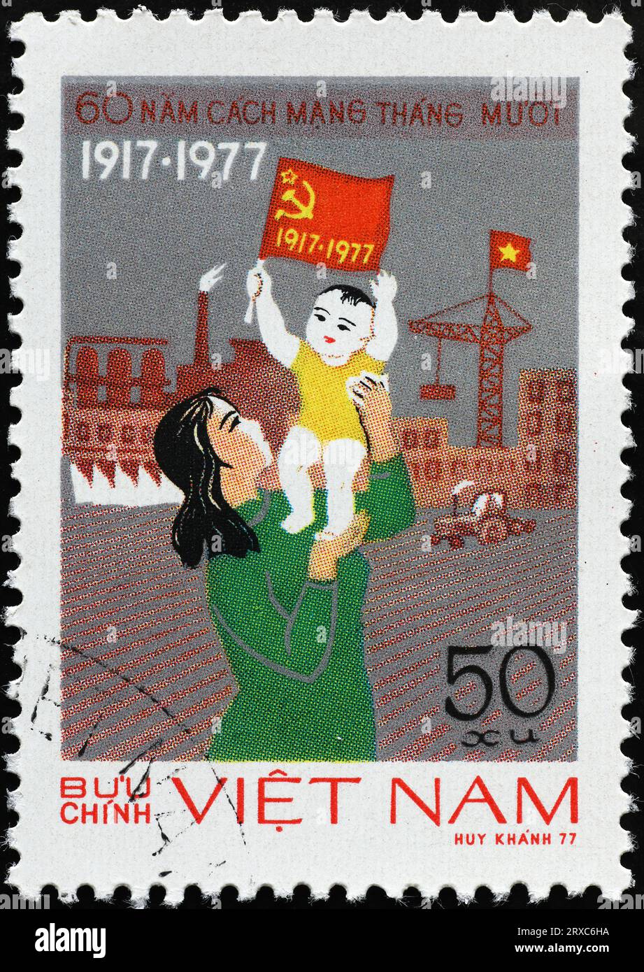 Propaganda comunista su francobollo vietnamita d'epoca Foto Stock
