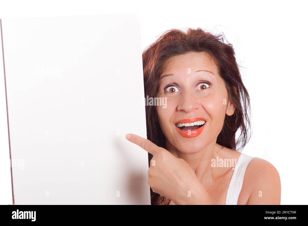 Donna che punta verso una lavagna vuota Foto Stock