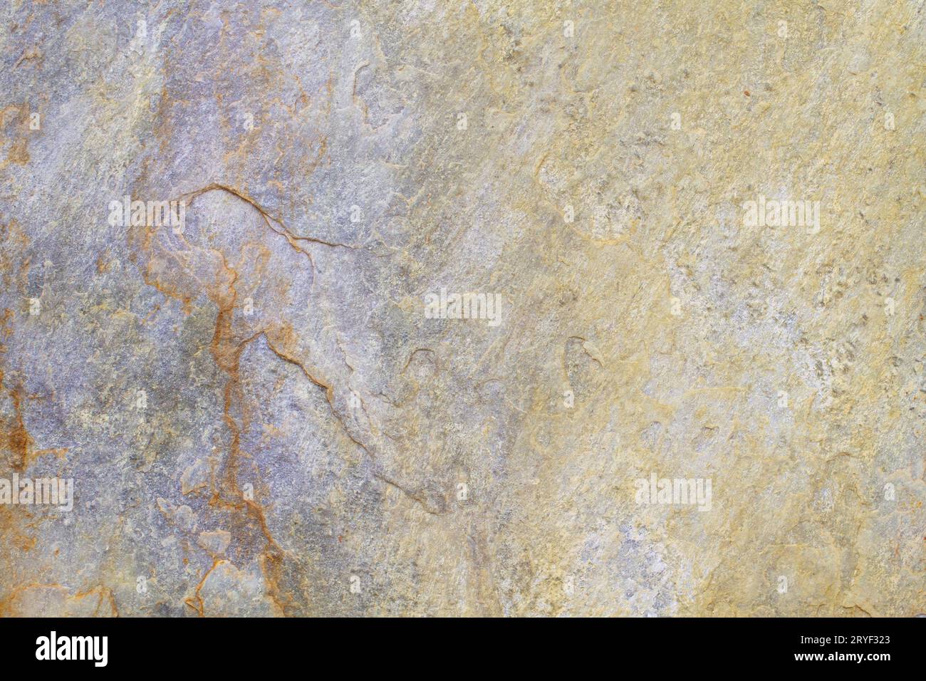 Fondo in pietra naturale con tonalità giallo, beige e viola Foto Stock