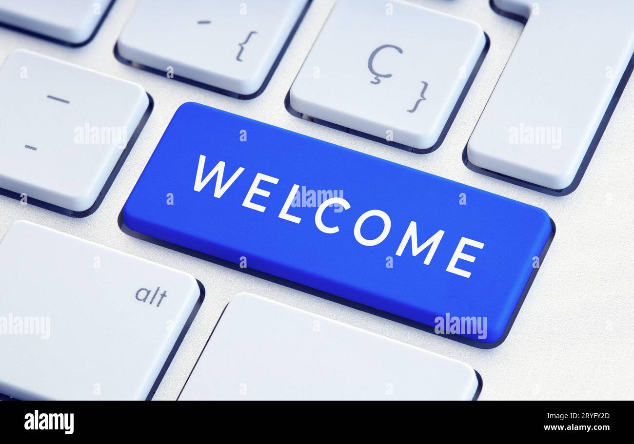 Parola di benvenuto sul tasto della tastiera del computer. Primo piano Foto Stock