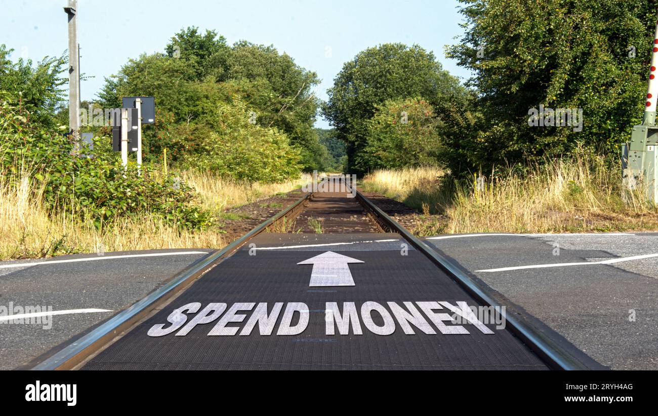 Strada segno spendere denaro Foto Stock