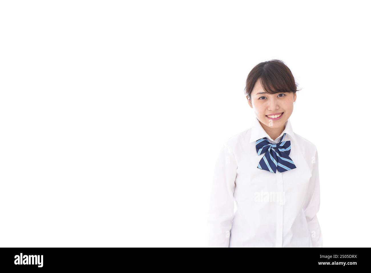 La scolaretta sorridente Foto Stock