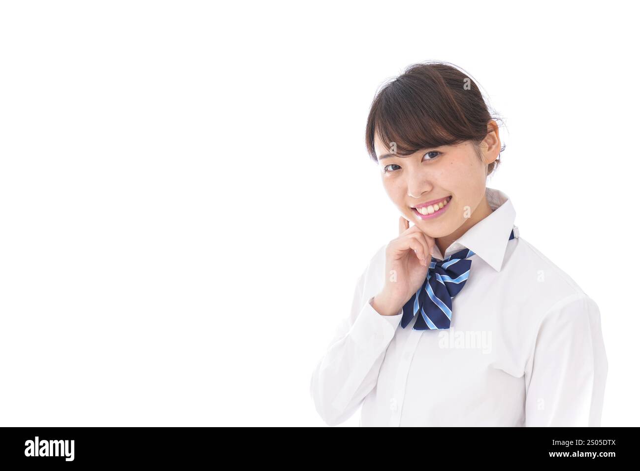 La scolaretta sorridente Foto Stock