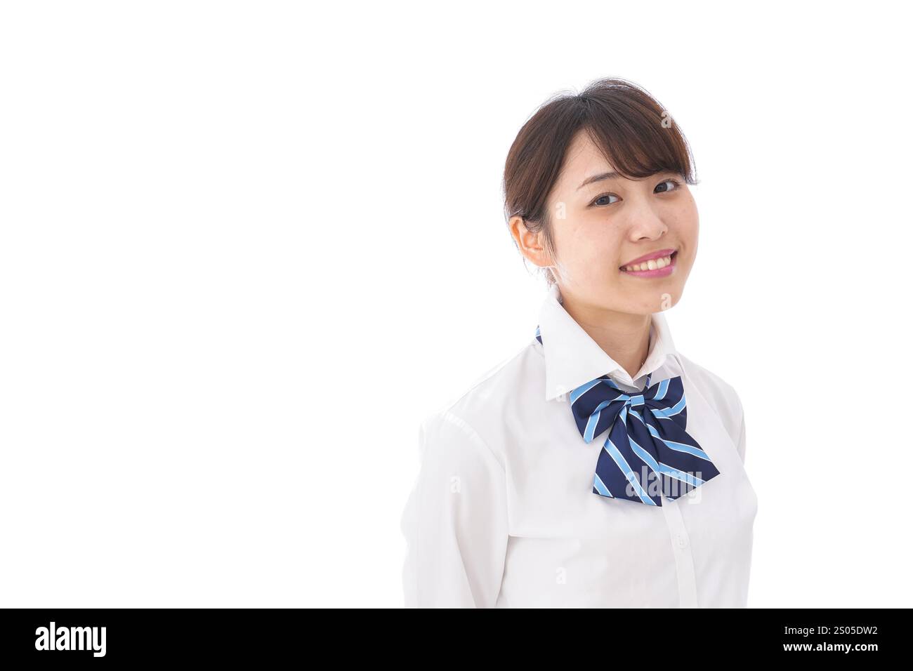 La scolaretta sorridente Foto Stock