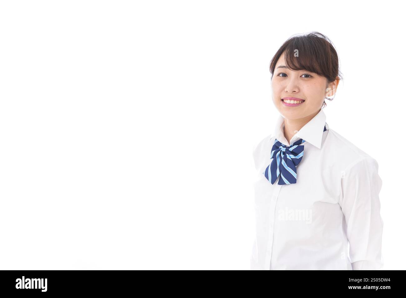 La scolaretta sorridente Foto Stock