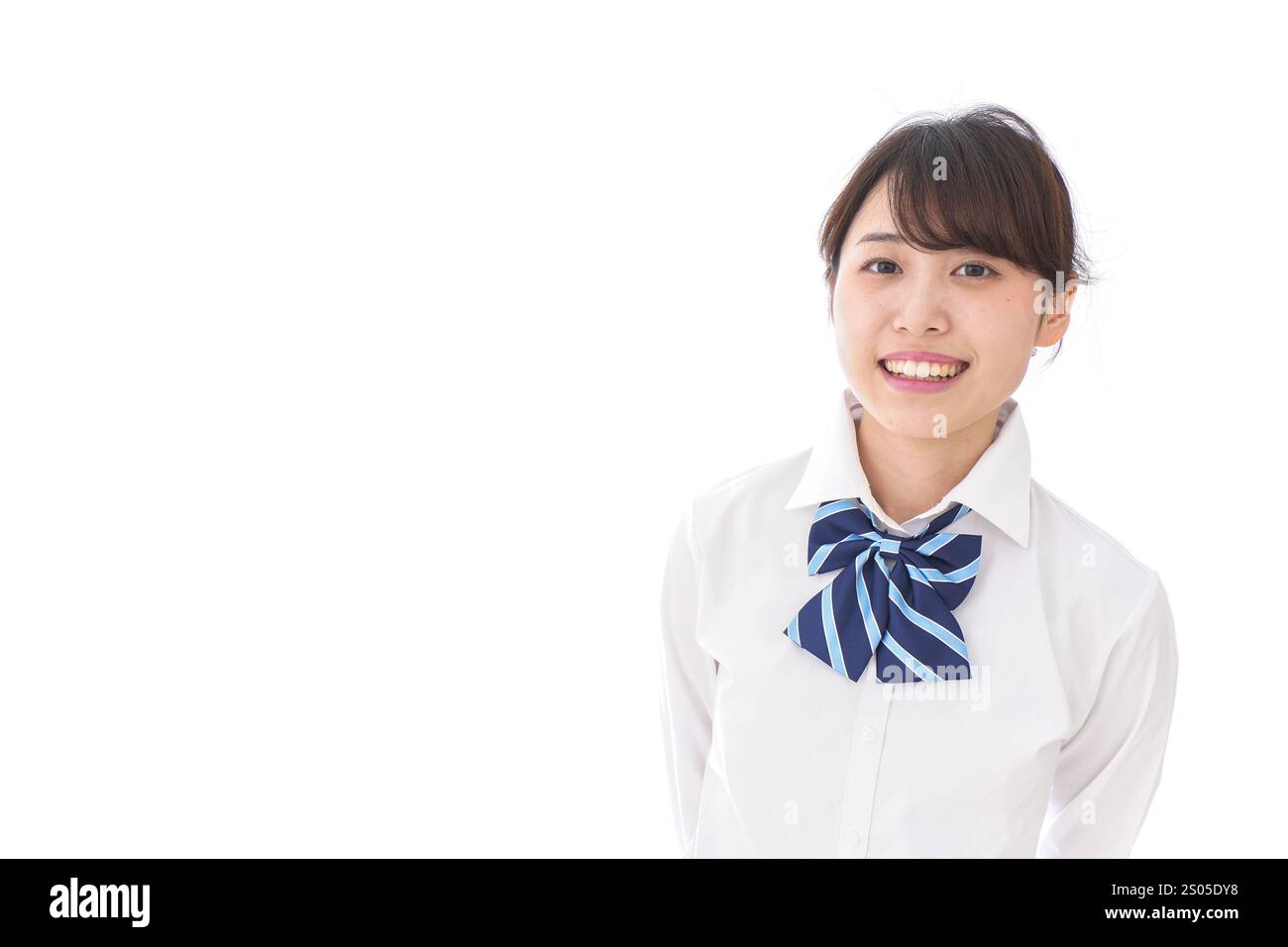 La scolaretta sorridente Foto Stock