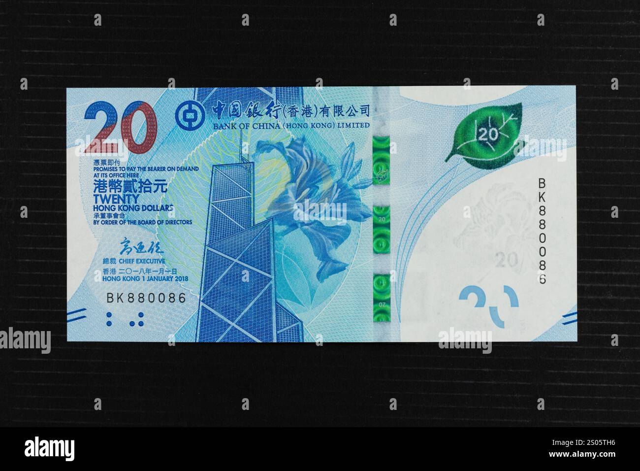 Banconota da venti dollari della Bank of China di Hong Kong. Il pannello frontale della banconota da 20 HK$ presenta un fiore di bauhinia e la Bank of China Tower Foto Stock