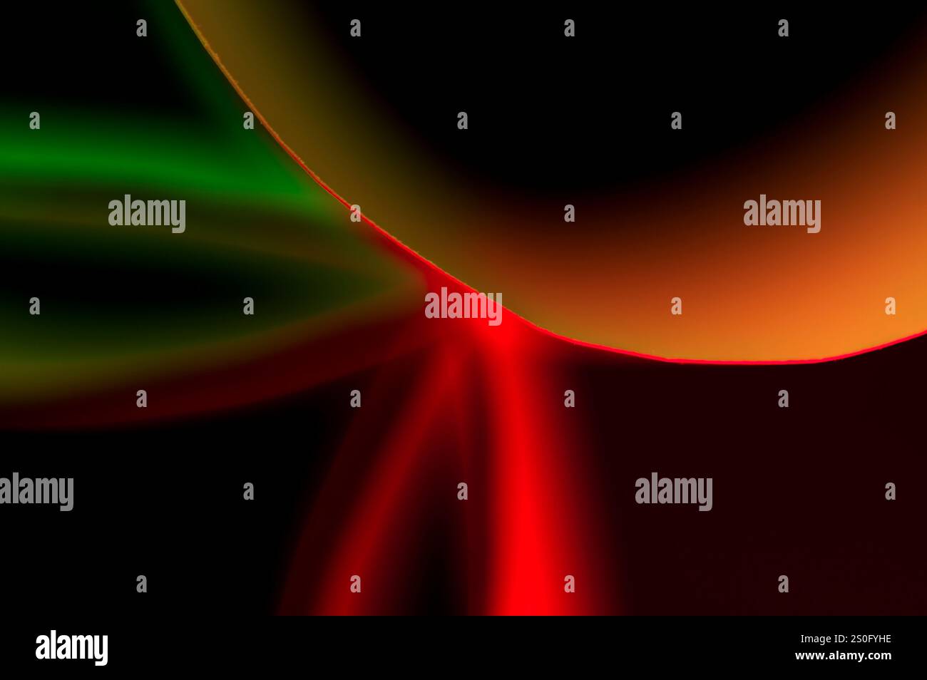 Sfondo astratto giallo, verde e rosso su nero Foto Stock