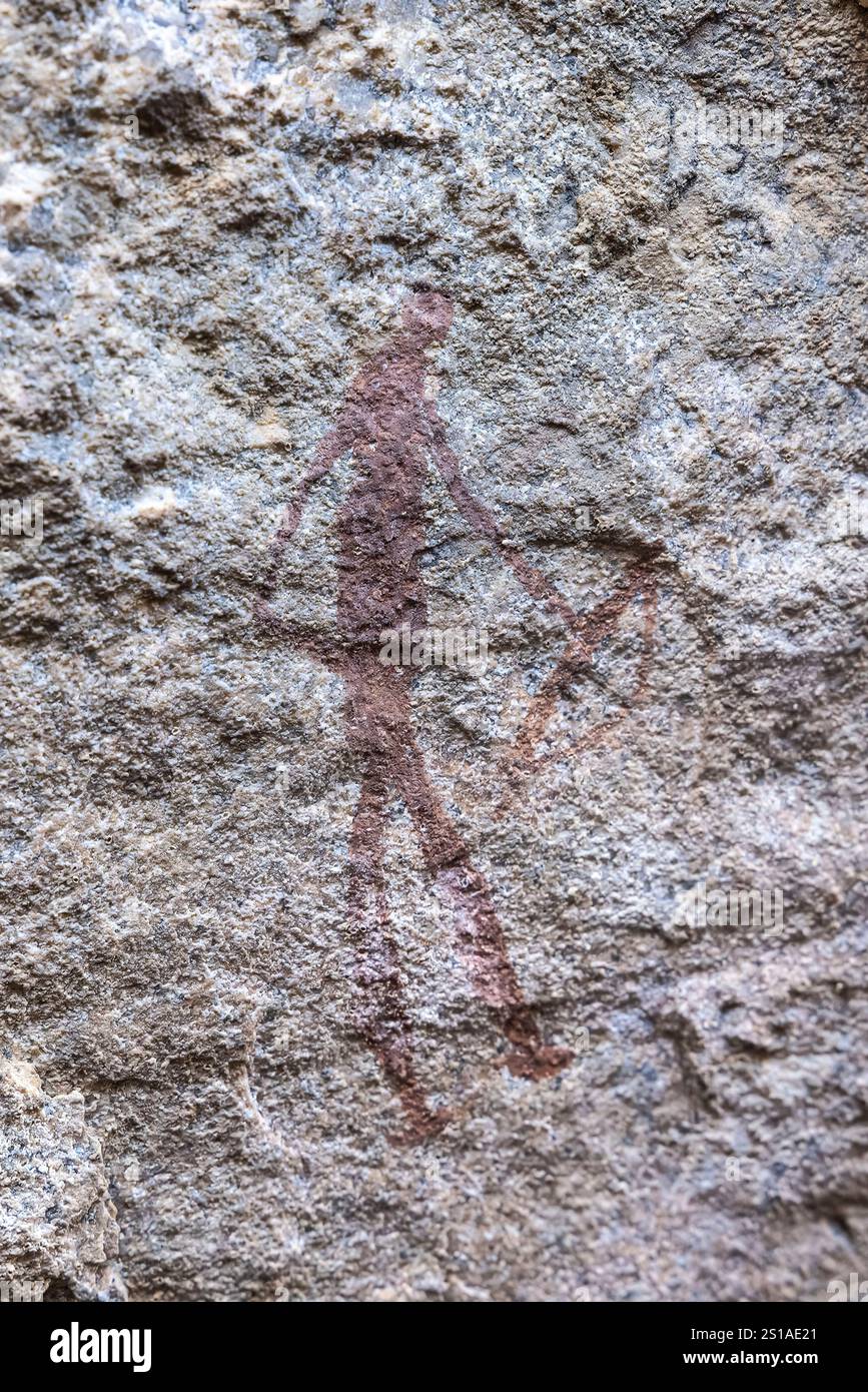 Namibia, Erongo District, Omaruru, Erongo Mountains, pittura rupestre di un cacciatore con un arco Foto Stock