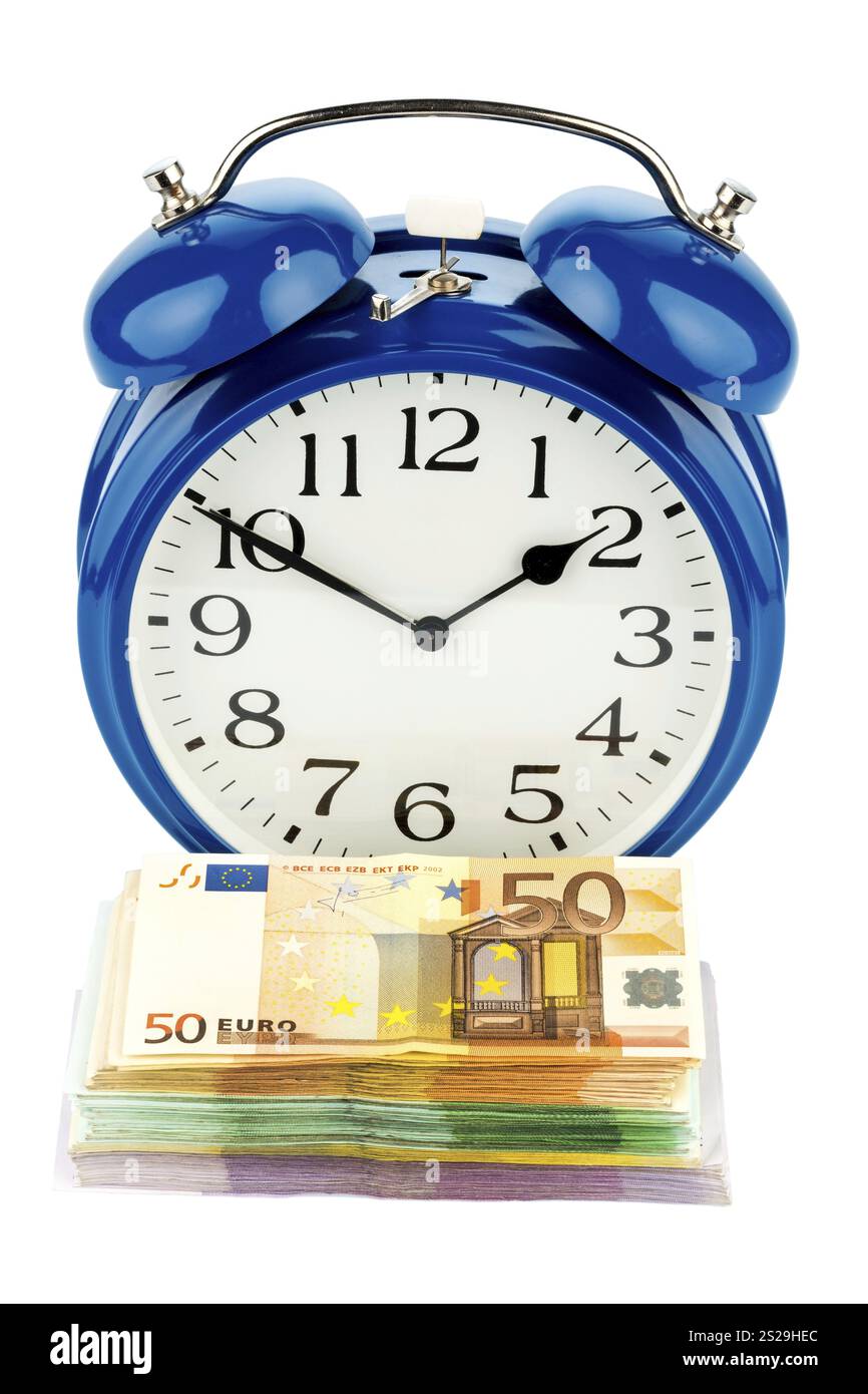 Sveglia e banconote, foto simbolica per i costi salariali, i costi del lavoro, il lavoro temporaneo Austria Foto Stock