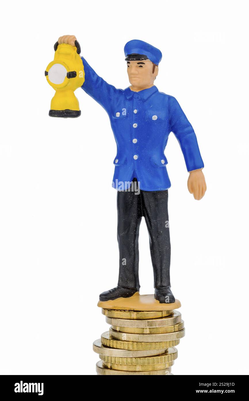 Impiegato ferroviario in cumulo di soldi, foto simbolica per il prepensionamento, costi per Bahn Austria Foto Stock