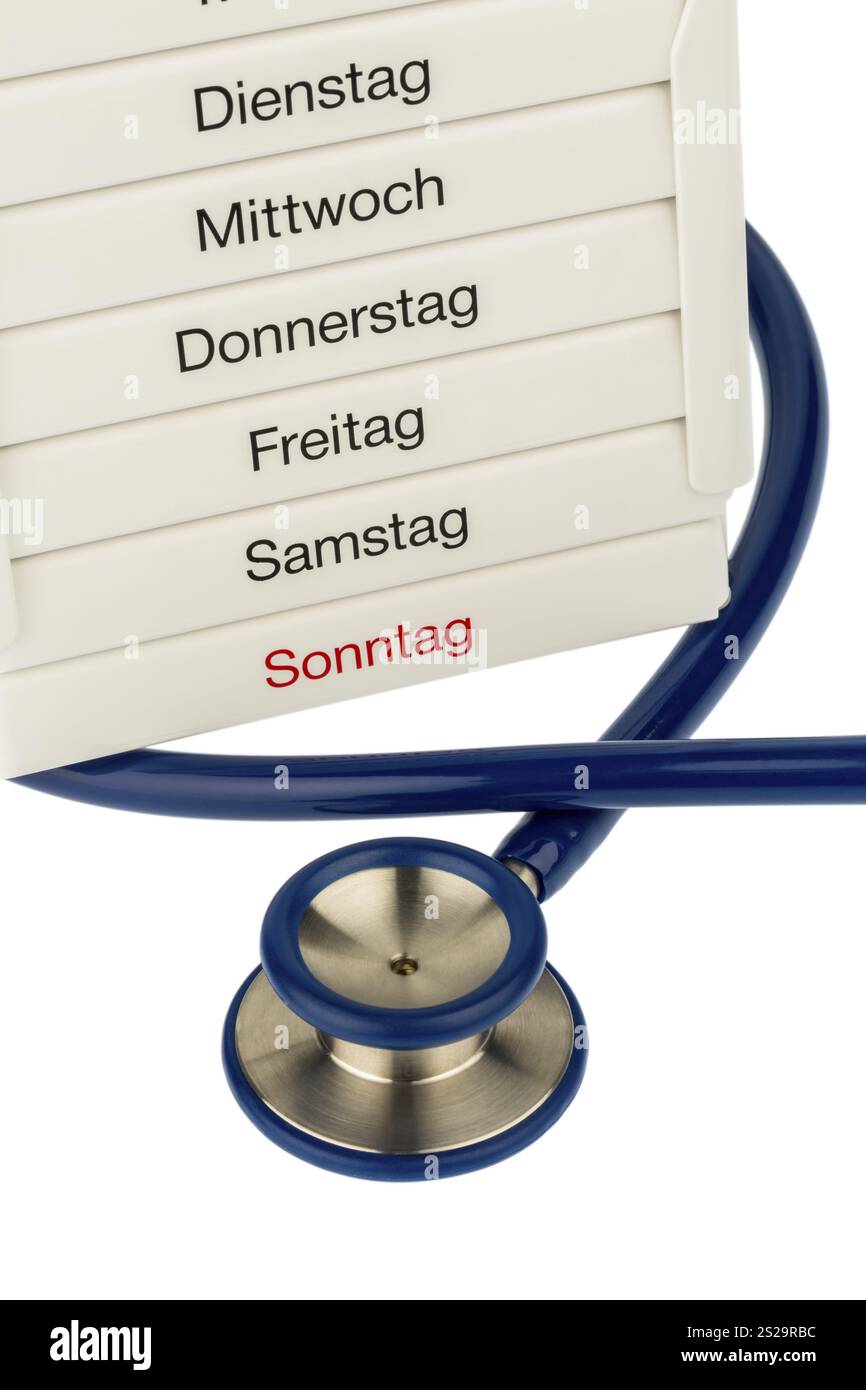 Dispenser per tablet e stetoscopio, foto simbolica per terapia, prescrizione medica e infarto Foto Stock