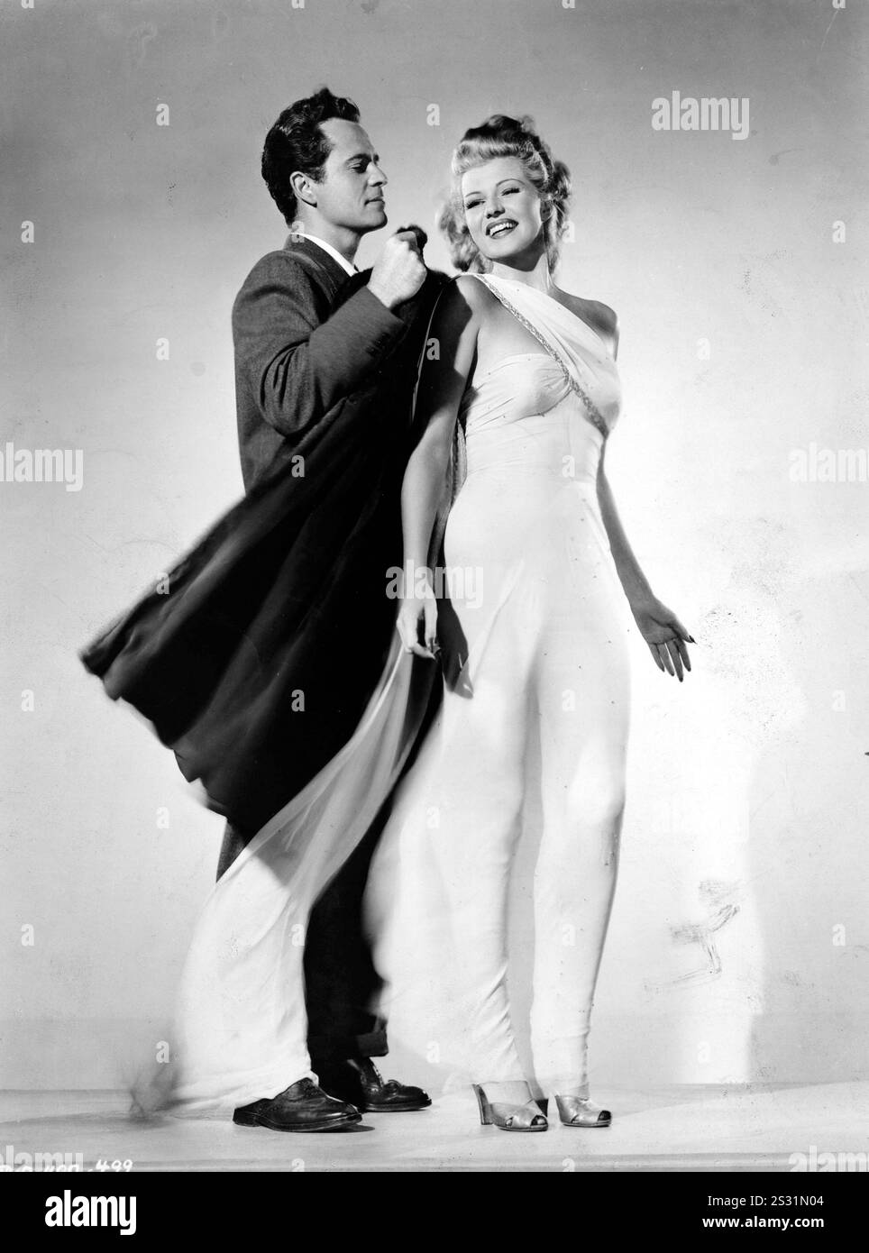 Larry Parks e Rita Hayworth che suonano Terpsichore data: 1947 Foto Stock