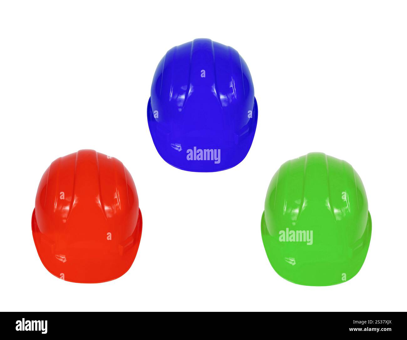 Immagine stock di elmetti rossi, blu e verdi isolati su bianco. Immagine stock di elmetti rossi, blu e verdi Foto Stock