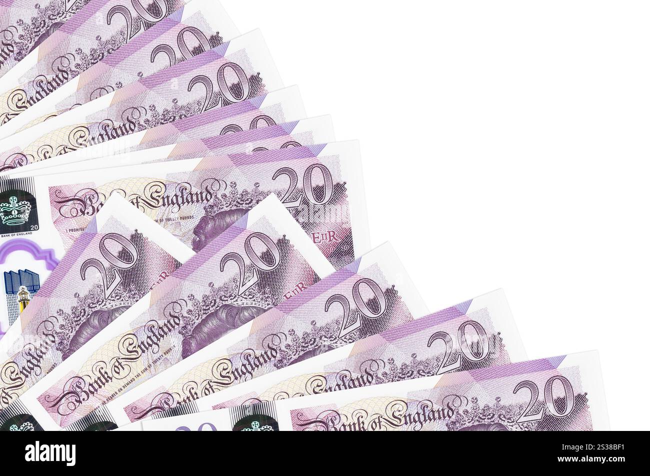 Le banconote da 20 sterline britanniche sono isolate su sfondo bianco con spazio di copia impilato nel primo piano della ventola. Concetto di tempo del giorno di paga o operazioni finanziarie. 20 Foto Stock