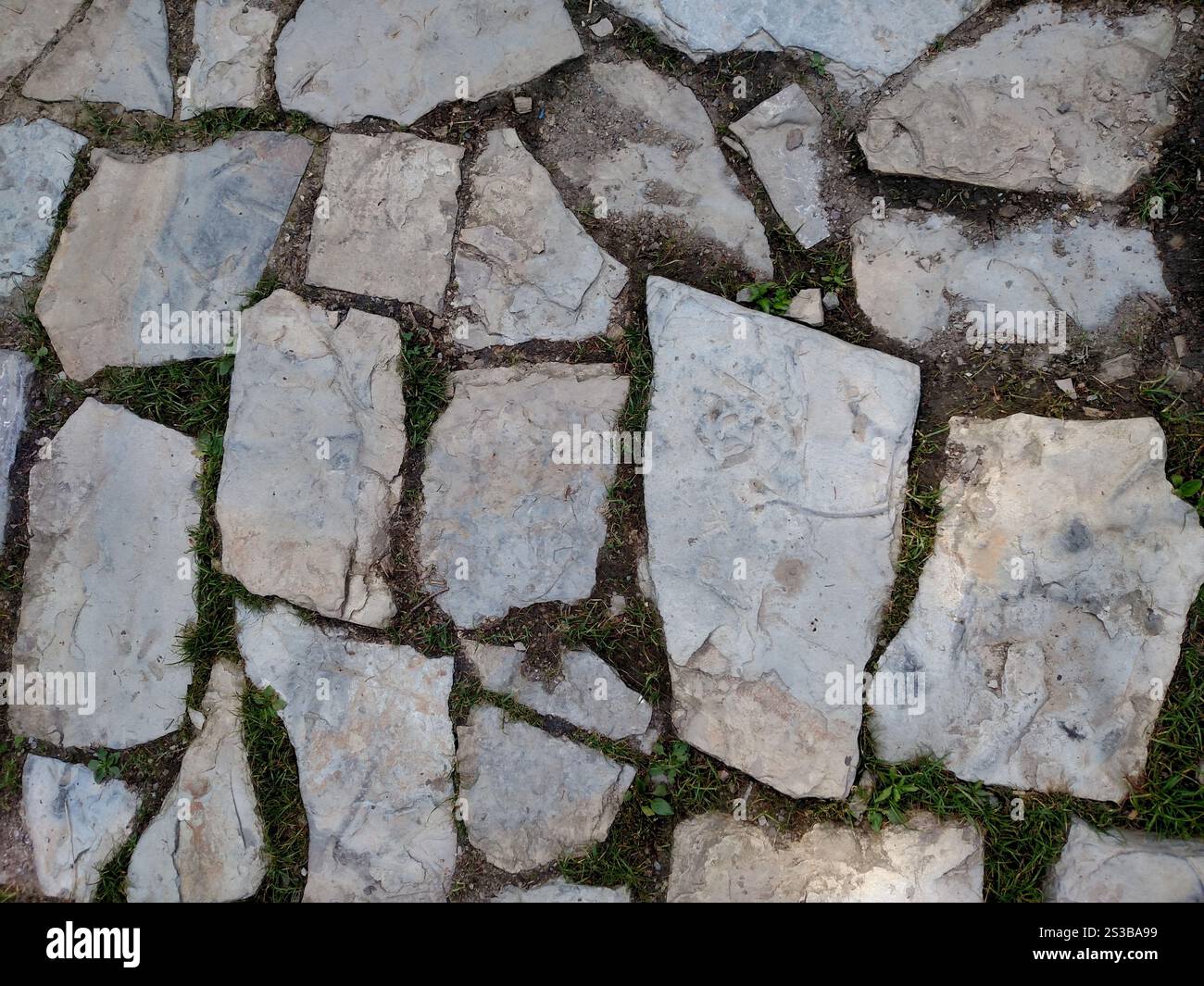 Immagine fotografica a colori orizzontale dello sfondo della parete del pavimento in pietra Foto Stock