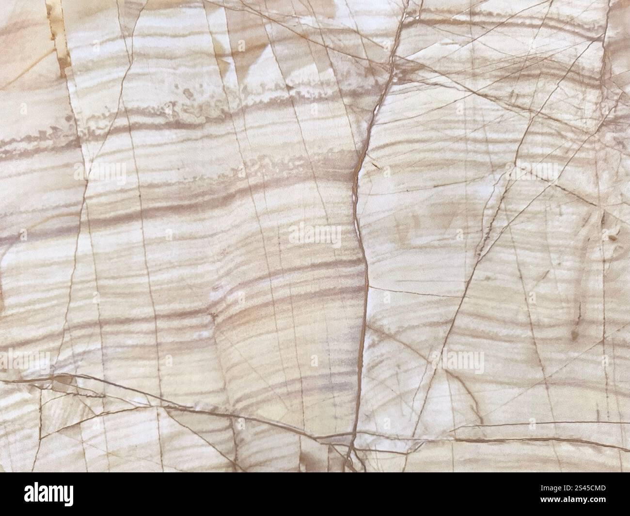 Primo piano di lastre di marmo naturale di colore giallo beige. Marmo color crema giallo chiaro con venature marrone scuro e taglio casuale, sfondo del pannello delle pareti senza cuciture Foto Stock