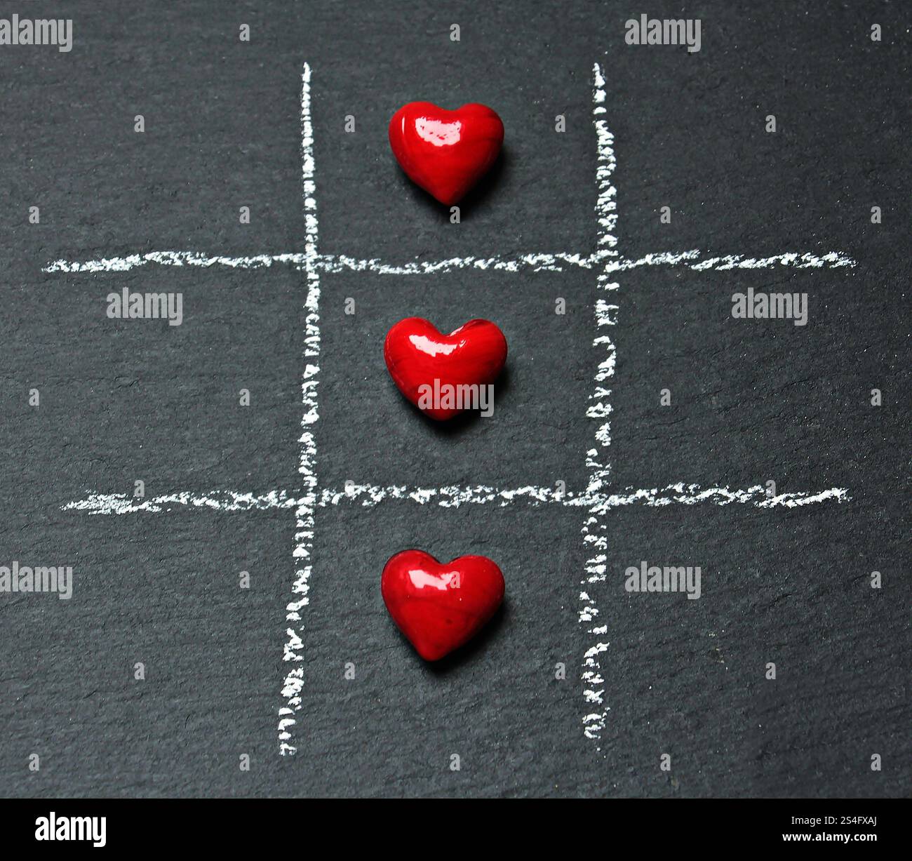 Foto del TIC tac con la foto del cuore rosso Foto Stock