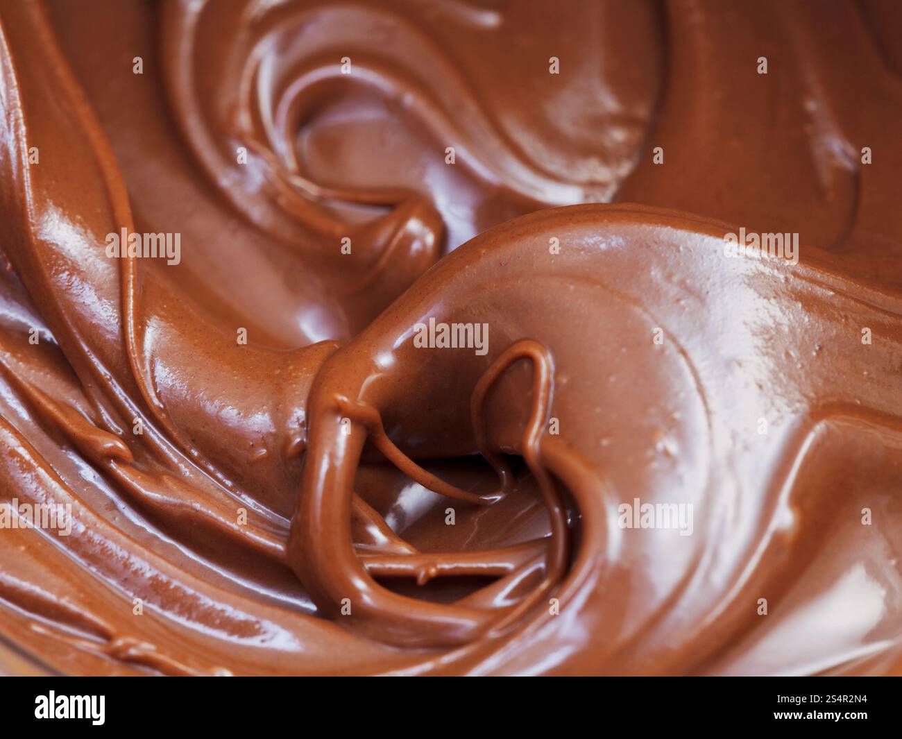 Sfondo di cioccolato fuso incolla close up Foto Stock