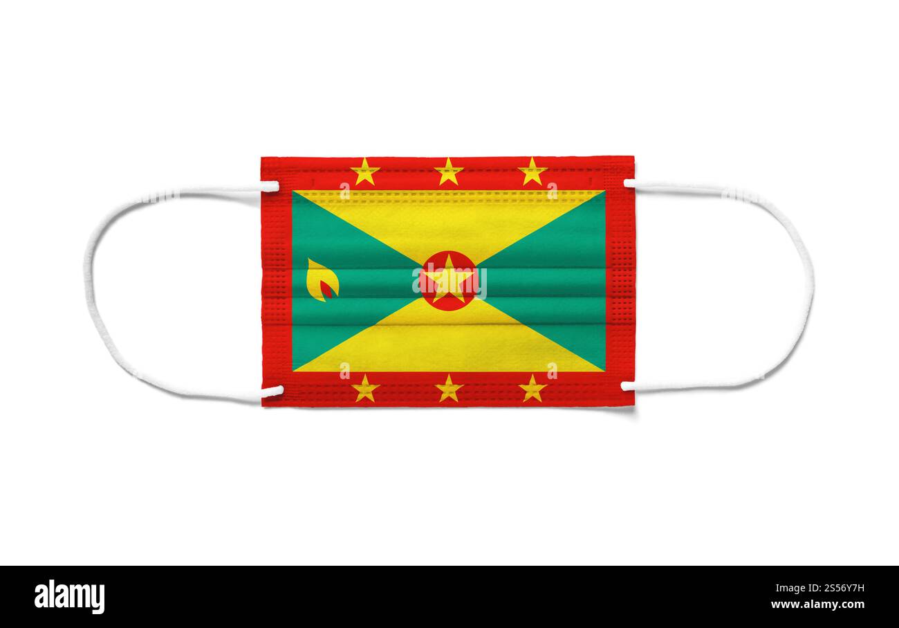 Bandiera di Grenada su una maschera chirurgica monouso. Sfondo bianco isolato. Bandiera di Grenada su una maschera chirurgica monouso. Sfondo bianco Foto Stock