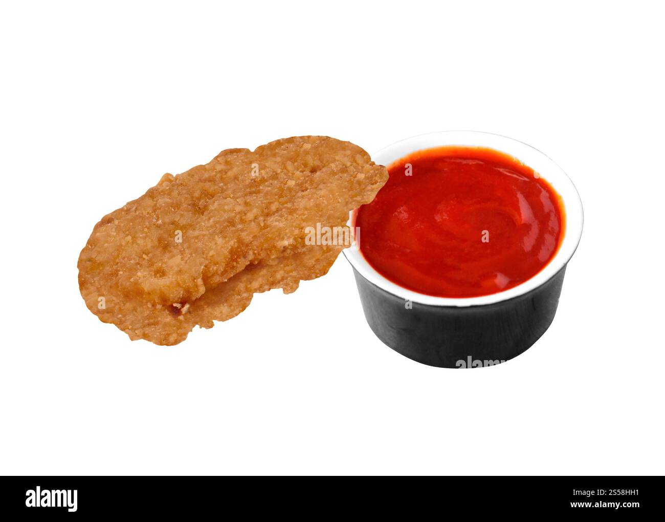Pepite di pollo fritta e ketchup isolati. Pepite di pollo fritta e ketchup Foto Stock