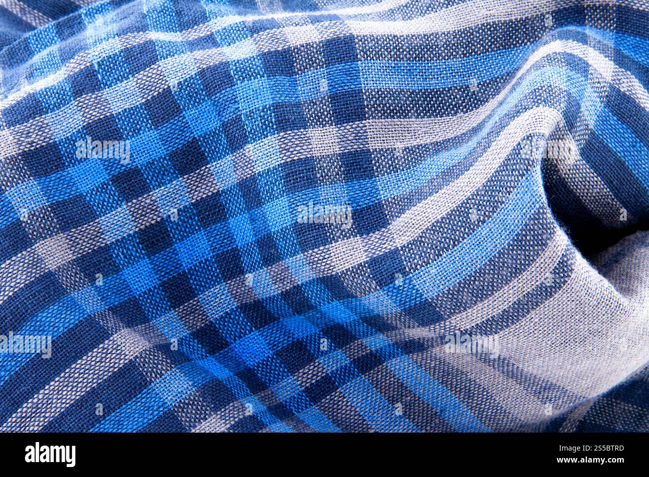 Primo piano in tessuto blu. Tessuto blu a scacchi Foto Stock