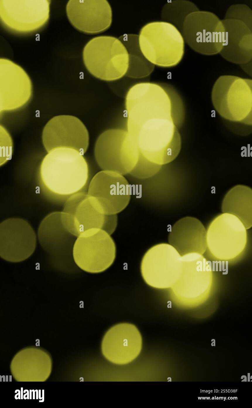 Effetto bokeh di fondo giallo oro luce sfocati sullo sfondo. Le luci di Natale Concept Foto Stock