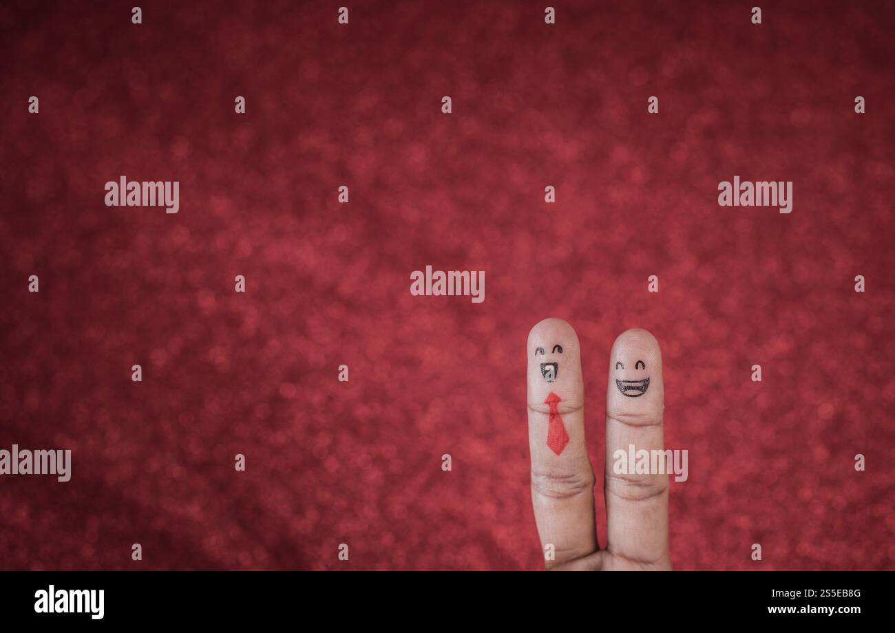 Dito con emozione su sfondo rosso Foto Stock