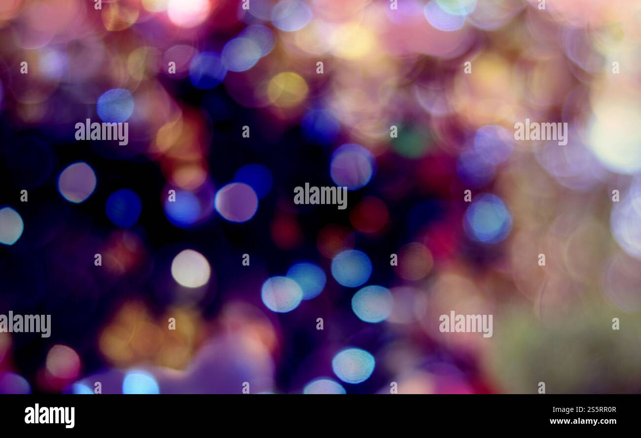 Astratto di bokeh pastello sfondo. Luce bokeh. Luce brillante sfocata spot su sfondo astratto multicolore Foto Stock