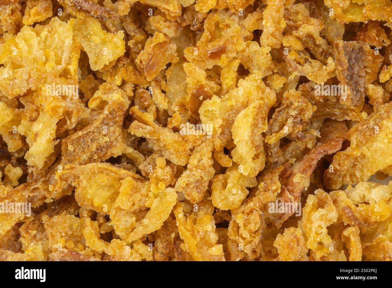 primo piano di una pila di cipolle fritte Foto Stock