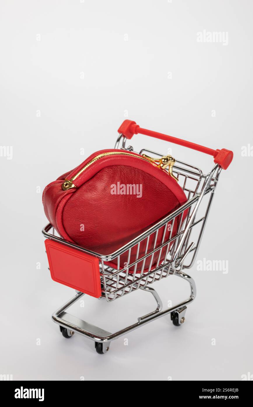 Carrello, borsetta rossa, sfondo bianco, Foto Stock