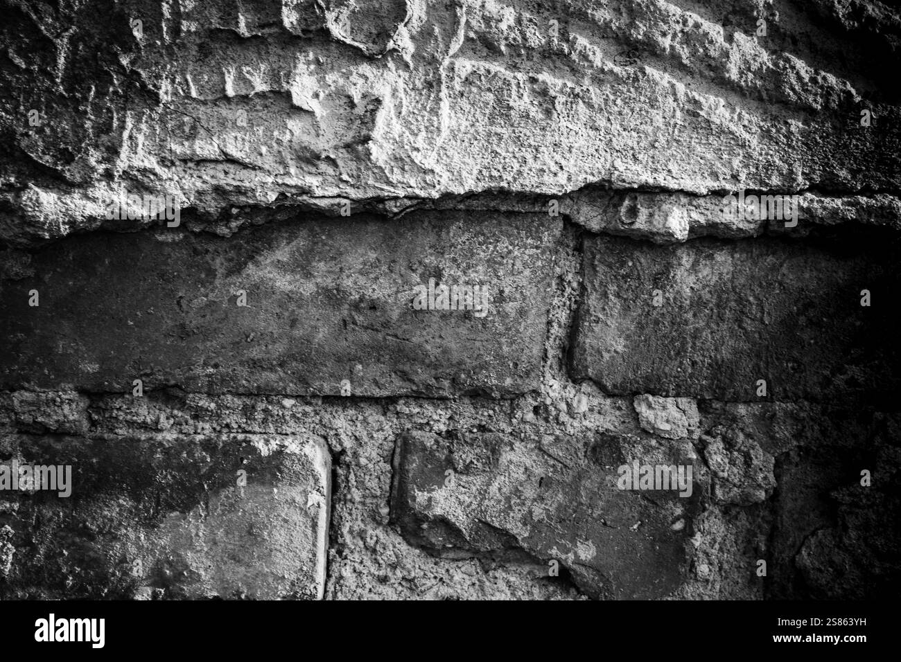 Pareti testurizzate con superfici in pietra ruvida e intonaco in tonalità monocromatiche Foto Stock