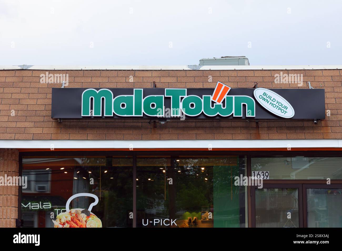 Segnaletica per MalaTown, un ristorante cinese in franchigia. Foto Stock