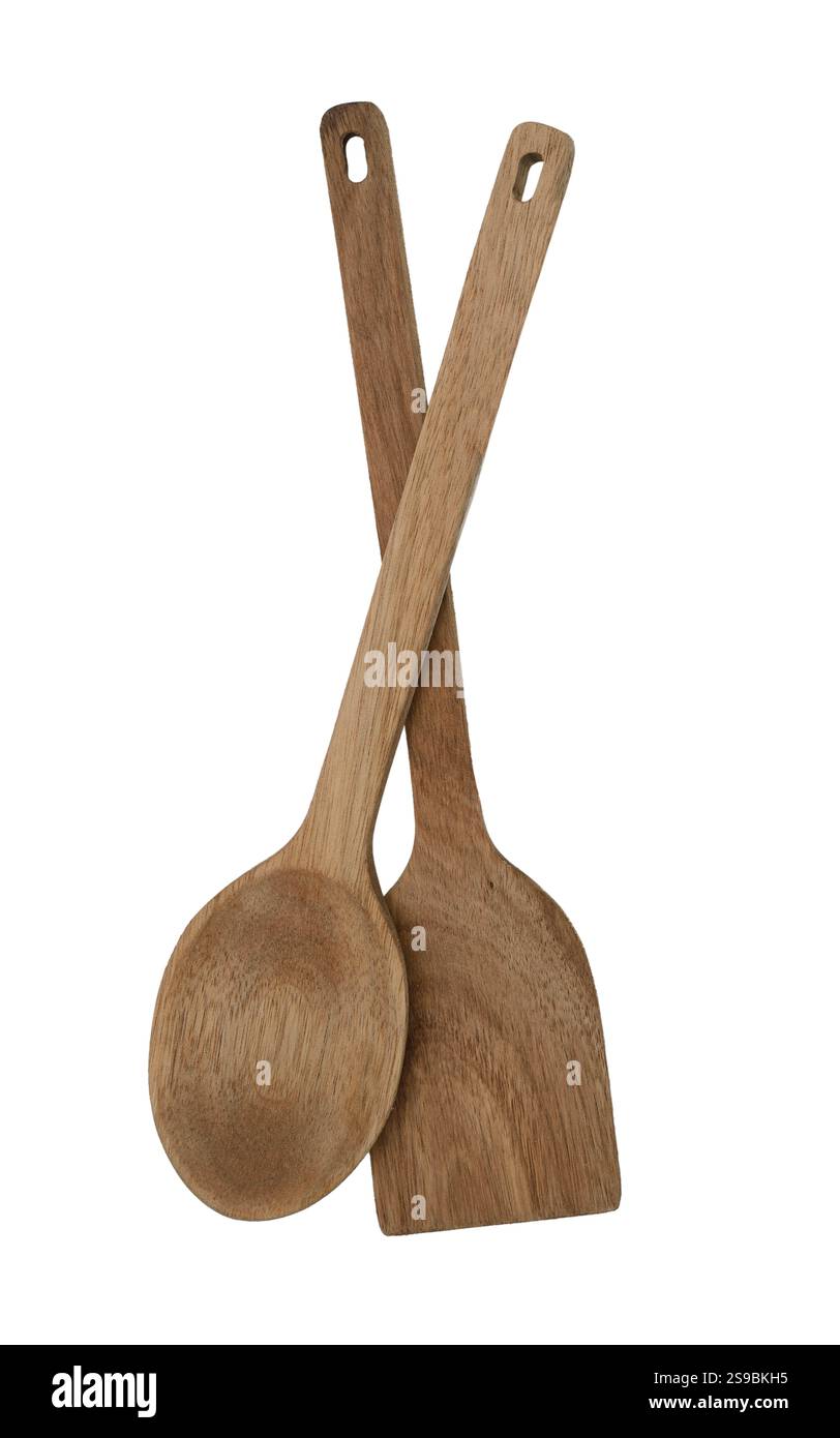 Un paio di utensili da cucina in legno, tra cui un cucchiaio e una spatola, realizzati in legno naturale. Perfetti per una cucina eco-compatibile, questi utensili sono dotati di tutti i comfort Foto Stock