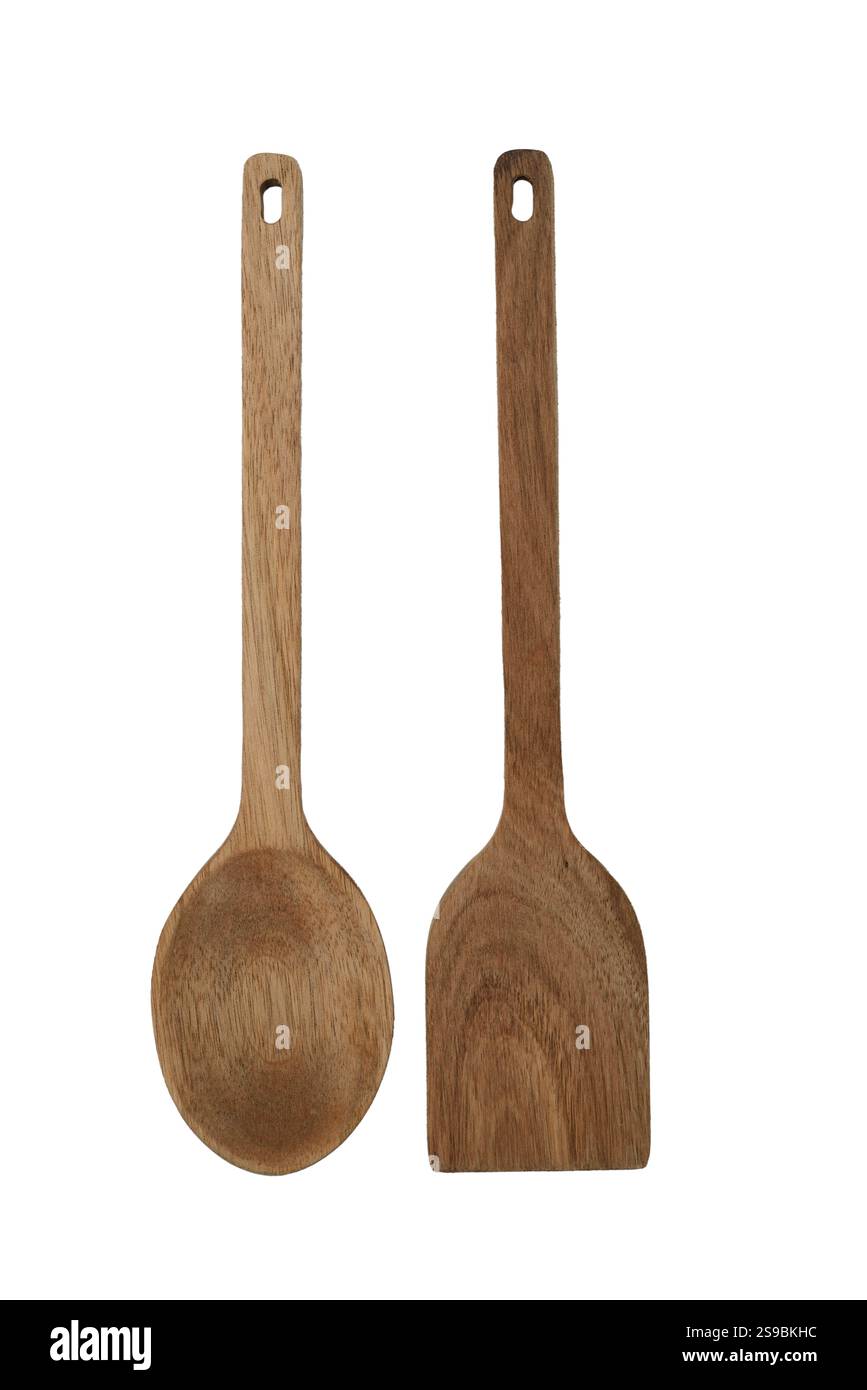 Un paio di utensili da cucina in legno, tra cui un cucchiaio e una spatola, realizzati in legno naturale. Perfetti per una cucina eco-compatibile, questi utensili sono dotati di tutti i comfort Foto Stock
