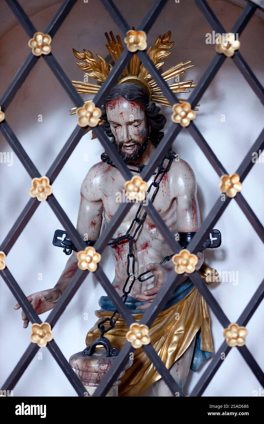 Abbazia di Plankstetten. Passione di Cristo. Cristo in legami dietro un cancello. Germania. Foto Stock