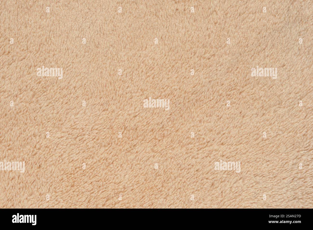 Primo piano di un tessuto in microfibra beige, morbido e morbido, ideale per sfondi, superfici ed elementi di design. Tessuto ad alta risoluzione Foto Stock